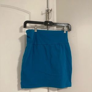 Papaya, teal skirt